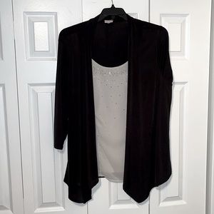 White shirt with black cardigan.